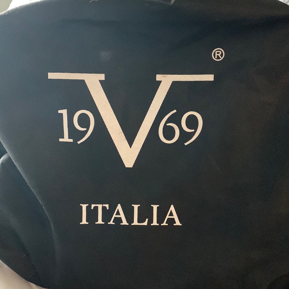 Versace black bag with dust cover.